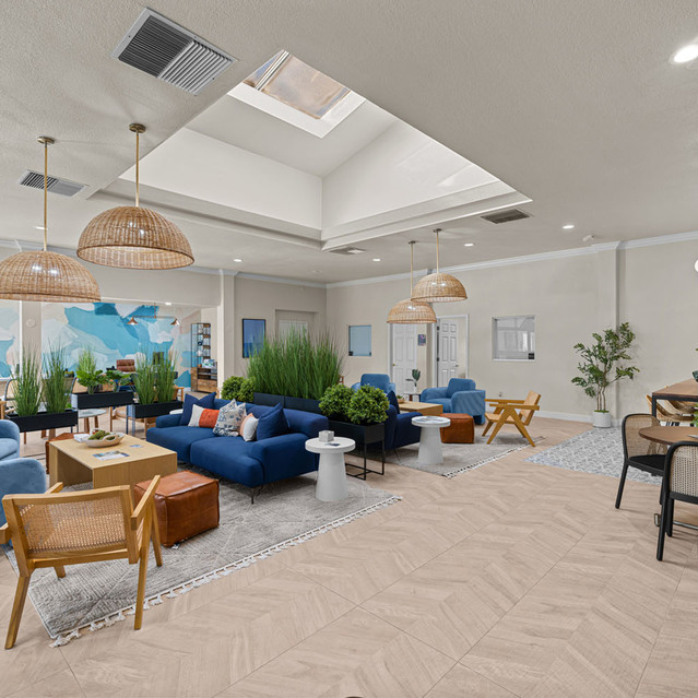 The Park at Positano - Lobby Area with Blue Sofas and Green Plants